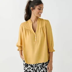 Blouse unie col tunisien, manches coudes smockées
