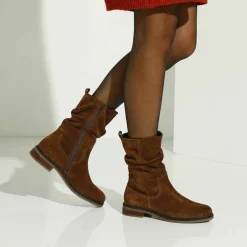 Bottes fourrées en cuir plissé
