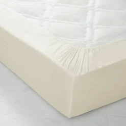 Drap-housse uni polyester-coton 57 fils/cm² - bonnet 32 cm