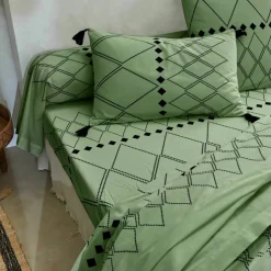 Linge de lit Massaï coton à motifs graphiques et finitions pompons