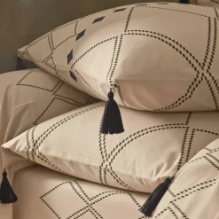 Linge de lit Massaï coton à motifs graphiques et finitions pompons