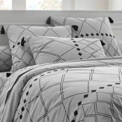Linge de lit Massaï coton à motifs graphiques et finitions pompons