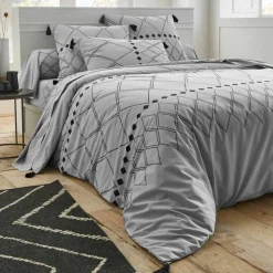 Linge de lit Massaï coton à motifs graphiques et finitions pompons