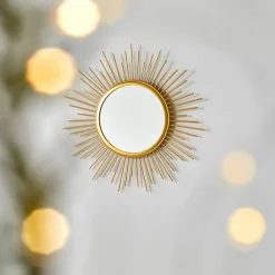 Miroir forme soleil en métal doré