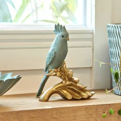 Statuette perroquet sur fleur dorée